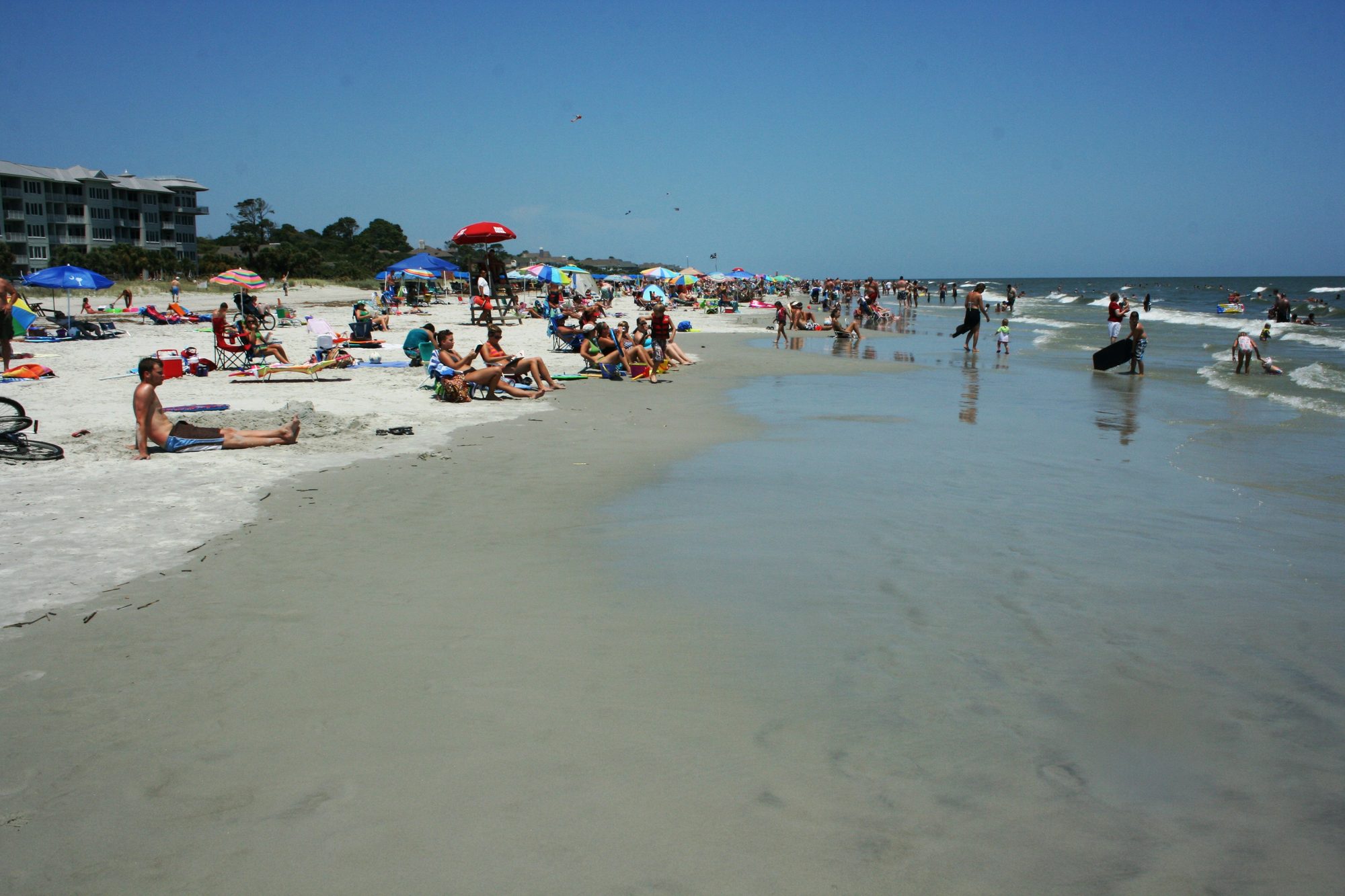 Wide public beach and oceanfront buildings on Hilton Head Island
